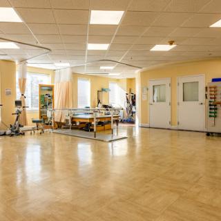 A well-equipped physical therapy space designed for rehabilitation and fitness activities.