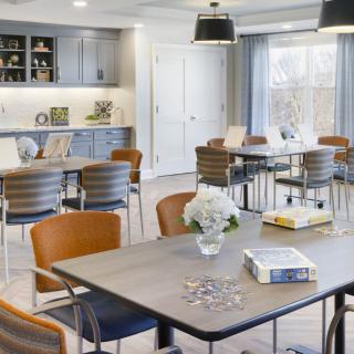 A modern dining area with contemporary furniture and natural lighting.