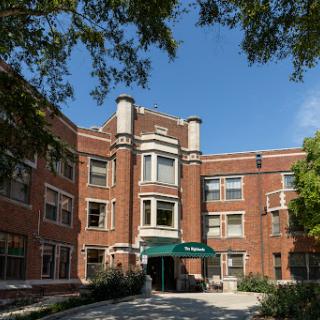 A beautifully designed historical brick building with a welcoming entrance.