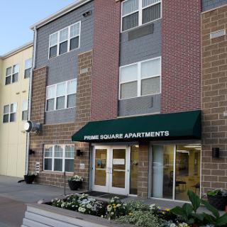 Exterior view of Pine Square Apartments, showcasing modern residential architecture.