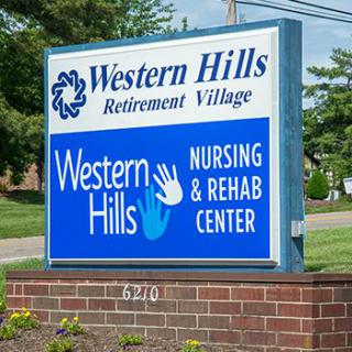 Sign for Western Hills Retirement Village and Nursing & Rehab Center.