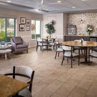 A modern dining area with sleek furniture and a cozy ambiance.