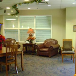 A cozy waiting area with comfortable seating and decorative elements.