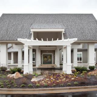 Elegant house with a welcoming entryway and landscaped garden.