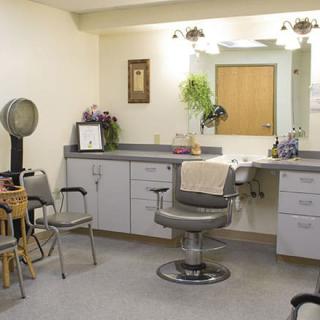 A hair salon interior with styling chairs and mirrors.