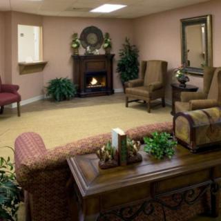 A cozy living room with elegant furniture and a fireplace.