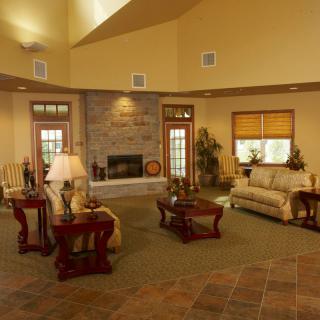 A cozy living room with a fireplace and elegant furnishings.