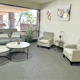 A modern and inviting living room space with comfortable seating and natural light.