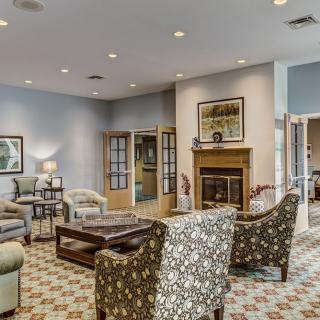 A cozy living room with comfortable seating and a fireplace.
