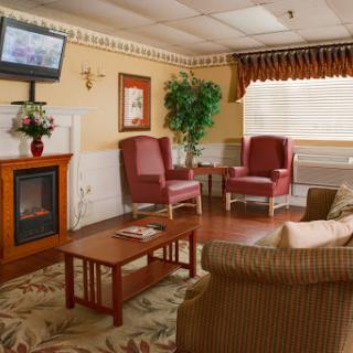 A cozy lounge area featuring comfortable seating and a warm ambiance.