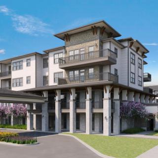 A modern residential building with multiple levels and balconies.