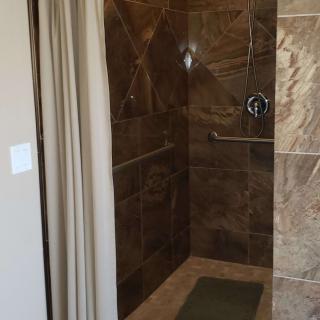 A modern bathroom shower with elegant tile work.
