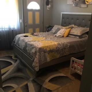 A bedroom featuring an impressive optical illusion with a 3D floor design.
