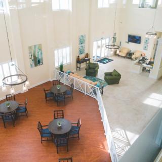A spacious and modern lobby with a cozy seating area and stylish furniture.