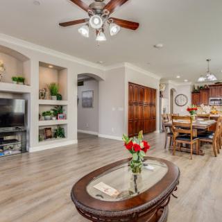 A beautifully designed open-concept living and dining area featuring modern decor and natural light.