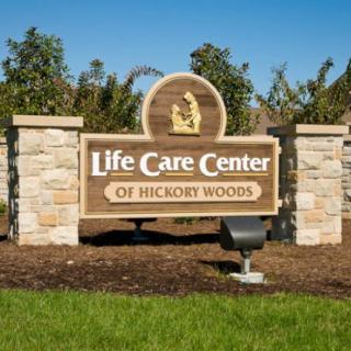 Sign for Life Care Center of Hickory Woods in an outdoor setting.