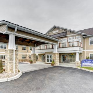 The entrance of a modern senior living facility.