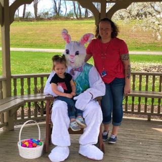A joyful moment captured with the Easter Bunny, bringing smiles to children during a festive celebration.