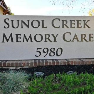 A sign for Sunol Creek Memory Care with the address number 5980.