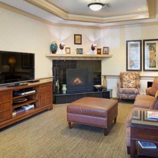 Cozy living room with a fireplace and television setup.