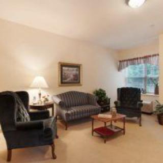 A cozy living room with classic furniture and soft lighting.