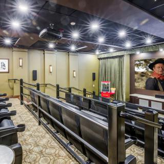A stylish home theater with comfortable seating and ambient lighting.