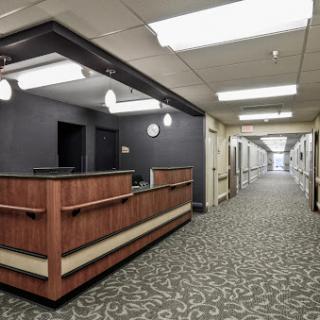 A view of the reception area in a healthcare facility, with a corridor extending into the background.