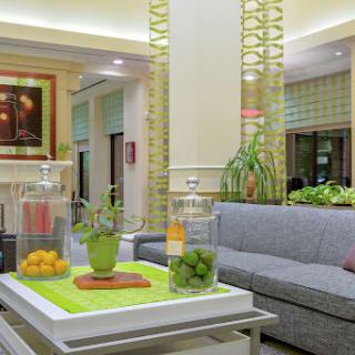 A modern and inviting lobby space featuring stylish furniture and vibrant decor.