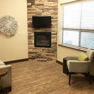 Cozy living room with a fireplace and seating area.