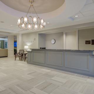A modern reception area with elegant lighting and seating arrangement.