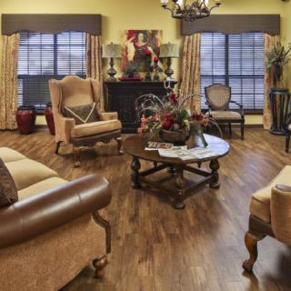 A cozy living room with traditional furnishings and decorative elements.