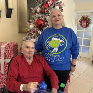 A joyful moment shared during the holiday season, surrounded by festive decorations.