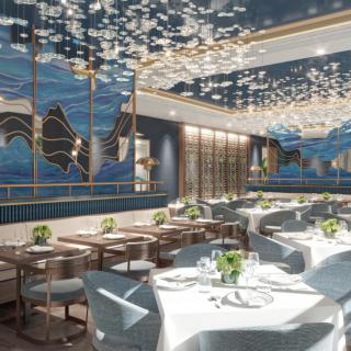 A luxurious restaurant interior with elegant decor and beautifully set tables.