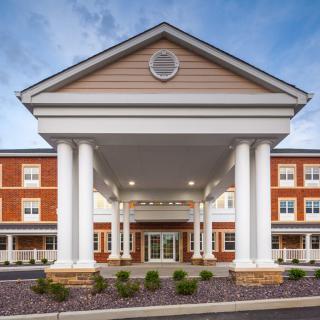 A grand building entrance with large columns and symmetrical architecture.