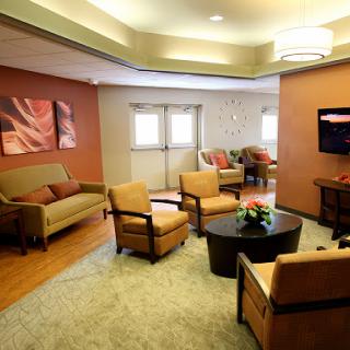 A cozy and inviting living room space with comfortable seating and soft lighting.
