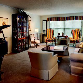 A cozy living room with modern furnishings and ample natural light.