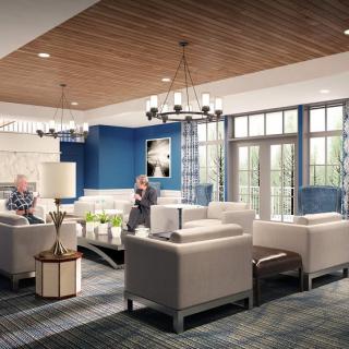 A modern lounge with comfortable seating and elegant decor.