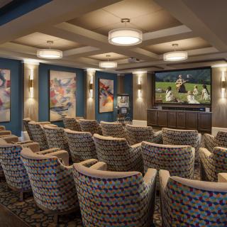 A luxurious home theater with comfortable seating and a large screen, perfect for movie nights.