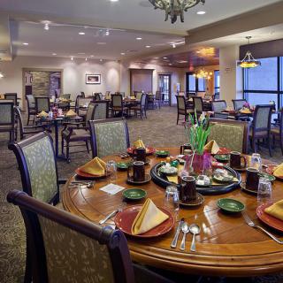 A well-decorated dining area with elegantly set tables in a restaurant.