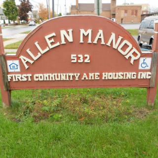 A sign for Allen Manor, part of First Community A.M.E. Housing Inc.