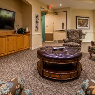 A cozy living room with comfortable seating and a television.
