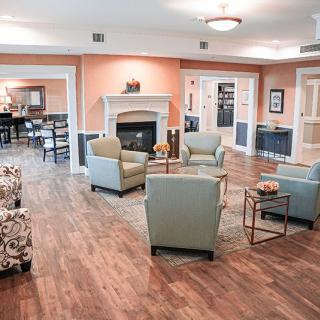 A cozy living room with comfortable seating and a fireplace.