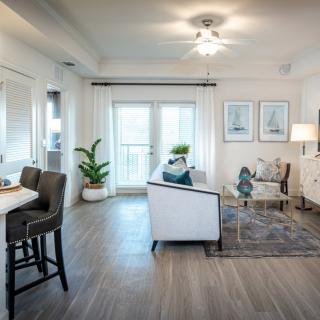 A modern and bright living room with stylish decor and comfortable furniture.