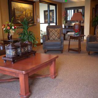 A cozy lobby area with comfortable seating and elegant decor.