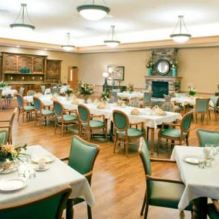 A beautifully set dining room with tables arranged for an event.