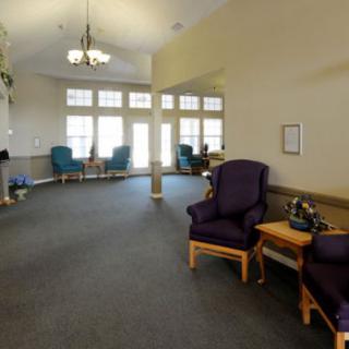 A spacious lobby area with comfortable seating and large windows allowing natural light.