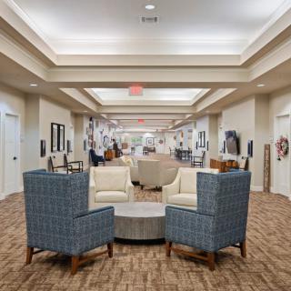 A spacious lobby with comfortable seating and bright lighting.