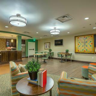 A modern lounge with comfortable seating and ambient lighting.