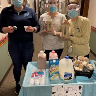 Members of a team promoting snacks and beverages in a community setting.