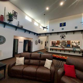 A spacious and cozy living room featuring modern furniture and stylish decor.
